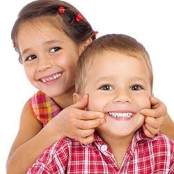 Children smiling and making faces.